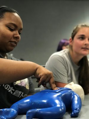 Students learn child CPR
